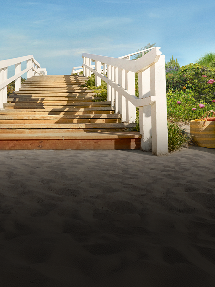 Idyllic beach scene with walking path to ocean